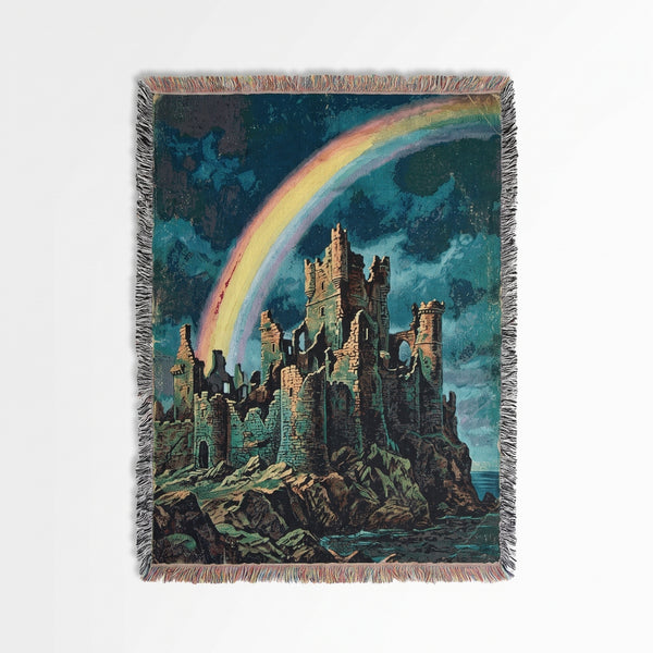 Castle Rainbow woven blanket showing crumbling castle ruins on a rocky cliff under a rainbow in a stormy teal sky