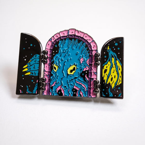 Cthulhu Opening Doors enamel pin, hinged starry black doors swung open on a pink stone arch revealing a blue tentacled Cthulhu with yellow eyes