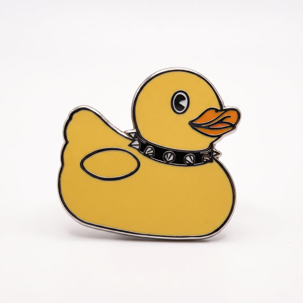 Punk Duck enamel pin, a yellow rubber duck wearing a black spiked collar