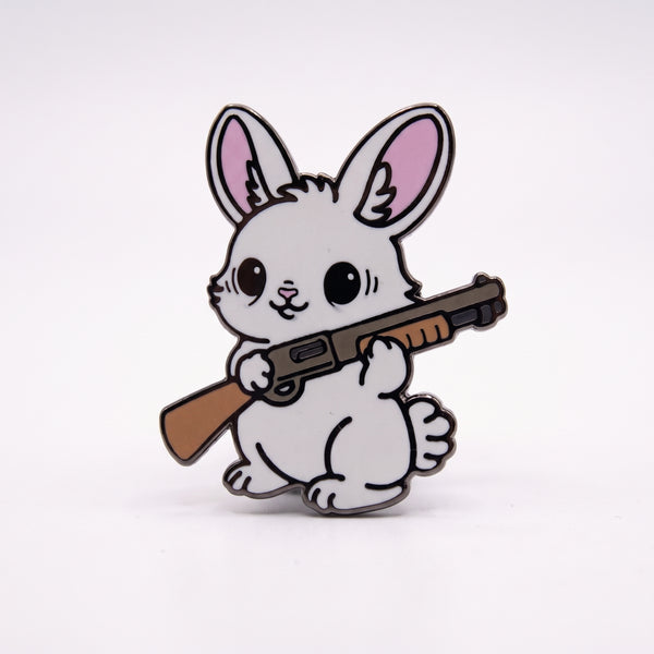 Rabbit With Shotgun enamel pin, a fluffy white bunny with pink ears holding a wooden-stocked gun