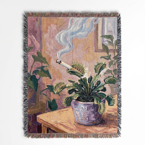 Smoking Flytrap woven blanket showing a potted venus flytrap smoking a cigarette on a windowsill
