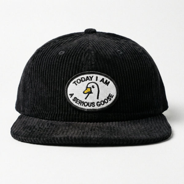 Black corduroy hat with embroidered patch saying Today I Am A Serious Goose