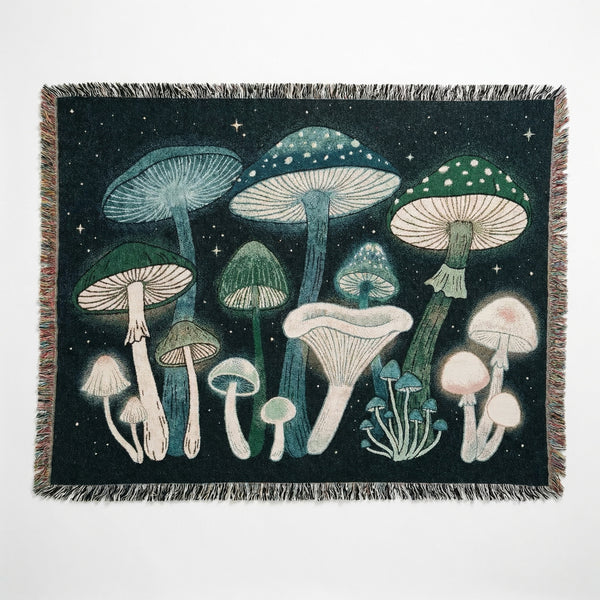Woven mushroom blanket with fringed edges and a starry sky background.