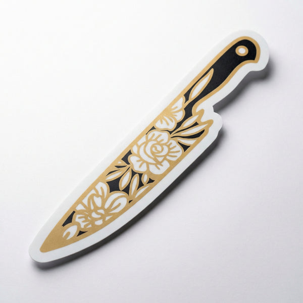 Giant vinyl sticker shaped like a chef's knife with gold floral pattern