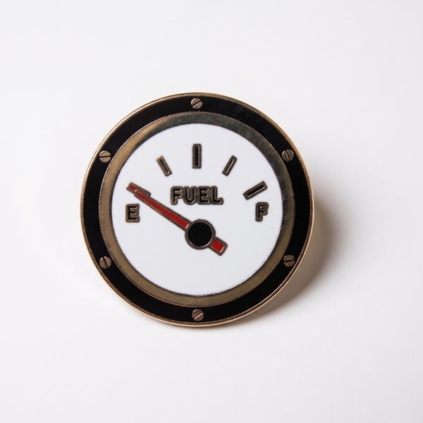 Running On Empty enamel pin, a round fuel gauge with the needle pointing to empty