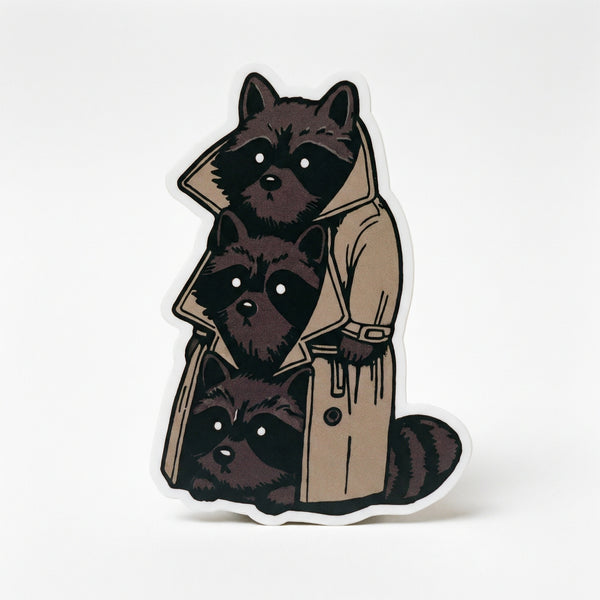 Sticker of three raccoons stacked inside a beige trench coat
