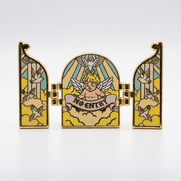 Hinged gold enamel pin of a heaven triptych with a cherub and no entry banner.