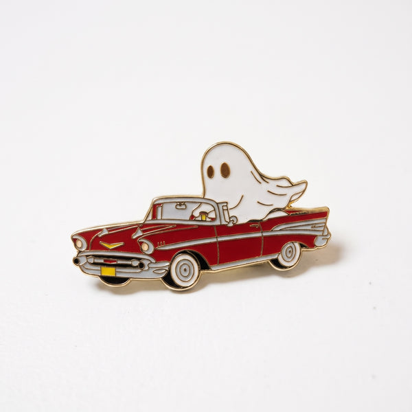 Joyride Ghost enamel pin, a white sheet ghost cruising in a red and white vintage convertible